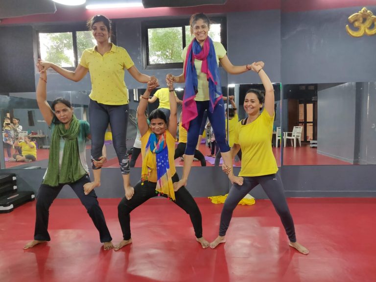 Women making human pyramid